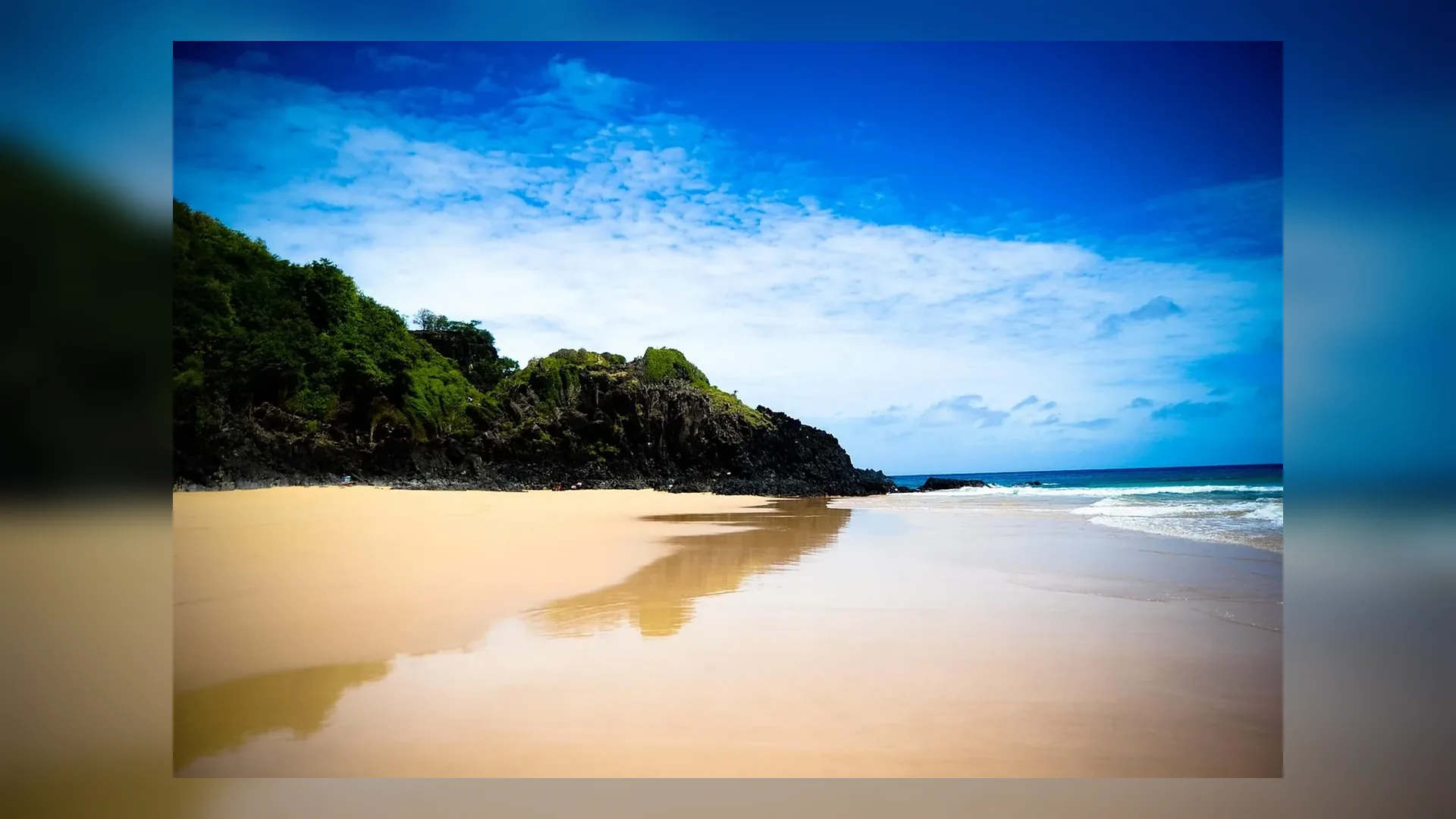 Baia do Sancho in Fernando de Noronha at golden hour in Brazil.